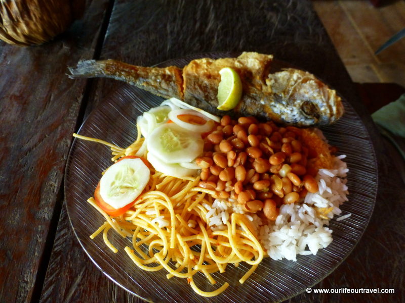 Usual food we got: rice, pasta, beans, manioca flour, fish and few slice of vegetables. Visiting the rainforest near Manaus, Brazil.