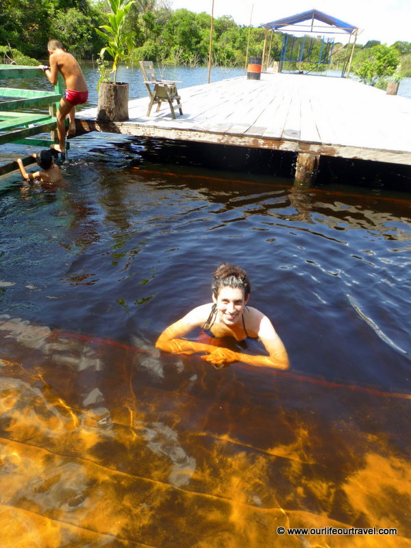 Swimming with locals. Rio Negro rainforest, Brazil.