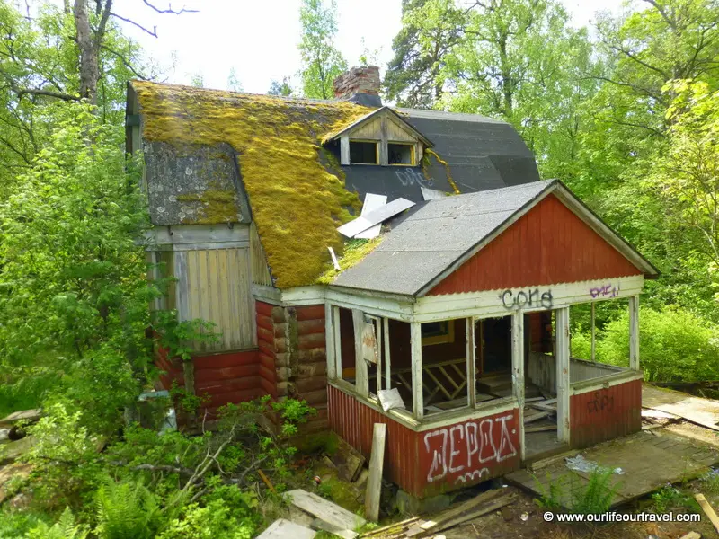 Abandoned villa with moss on the roof.