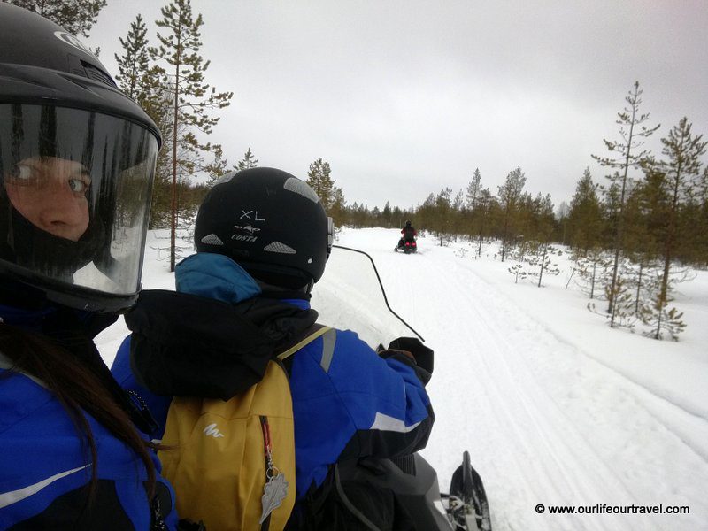 Riding a snowmobile near Rovaniemi, Finland